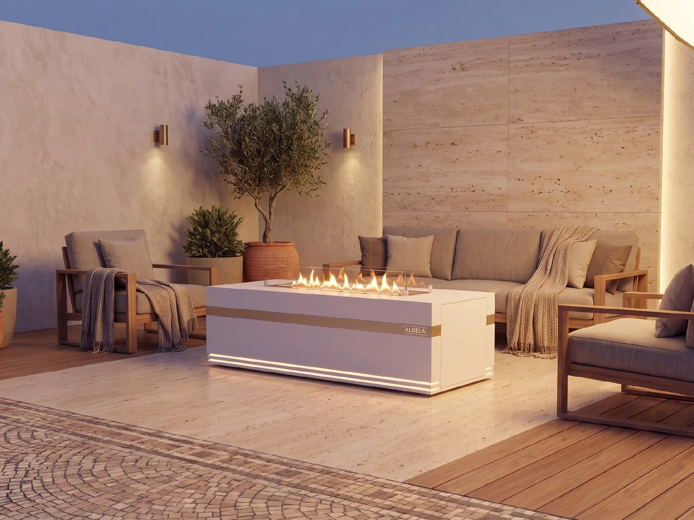 ALBELA HEART'S FLAME outdoor fire table on a terrace with olive trees at dusk